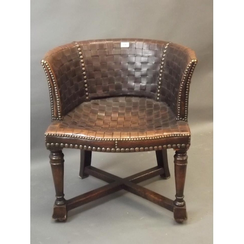 830 - A mahogany framed tub chair with brass studded latticed leather upholstery, 28