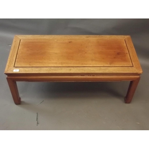 834 - A Chinese hardwood low table of rectangular form, on square legs, 16