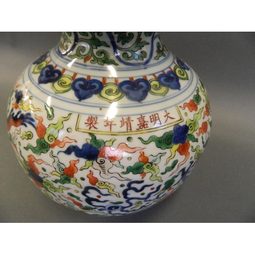 86 - A Chinese Doucai enamelled porcelain double gourd vase decorated with dragons chasing the flaming pe... 