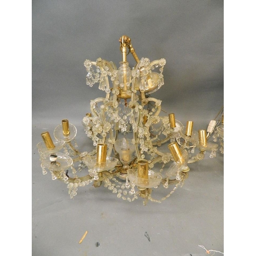 862 - A pair of twelve branch cut glass chandeliers with lustre drops, ex Savoy, 32