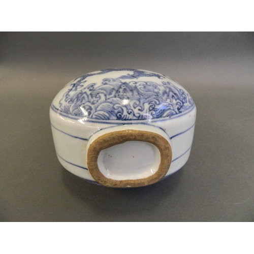 87 - A Chinese blue and white porcelain twin handled moonflask with painted decoration of a dragon above ... 