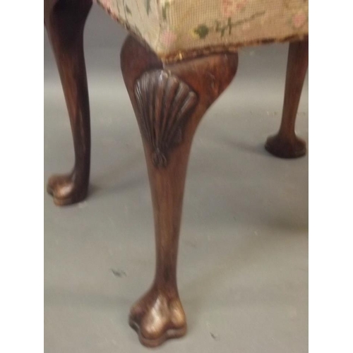 875 - A 1920s Georgian style walnut stool, raised on cabriole supports with pad feet