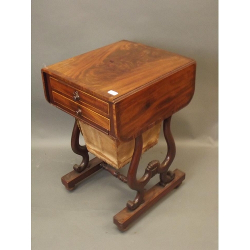 880 - A C19th figured mahogany drop leaf work table with two drawers and sliding basket, the top drawer wi... 