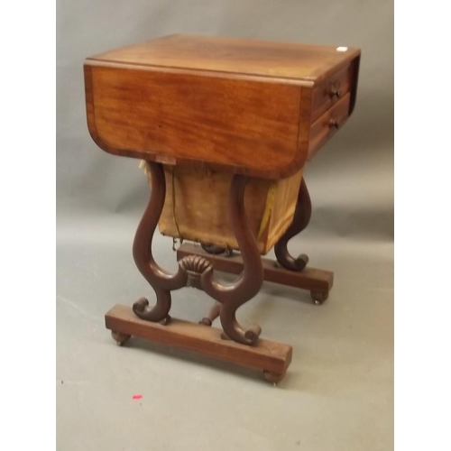 880 - A C19th figured mahogany drop leaf work table with two drawers and sliding basket, the top drawer wi... 