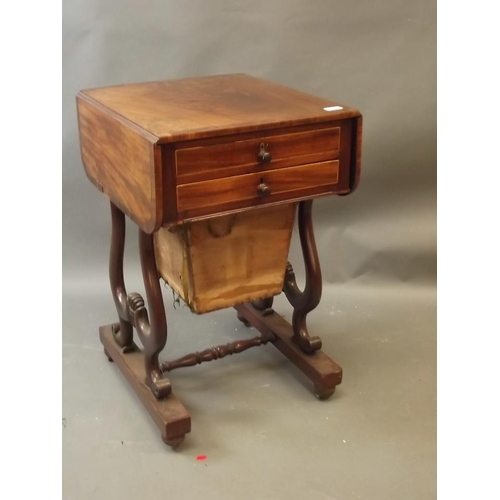 880 - A C19th figured mahogany drop leaf work table with two drawers and sliding basket, the top drawer wi... 