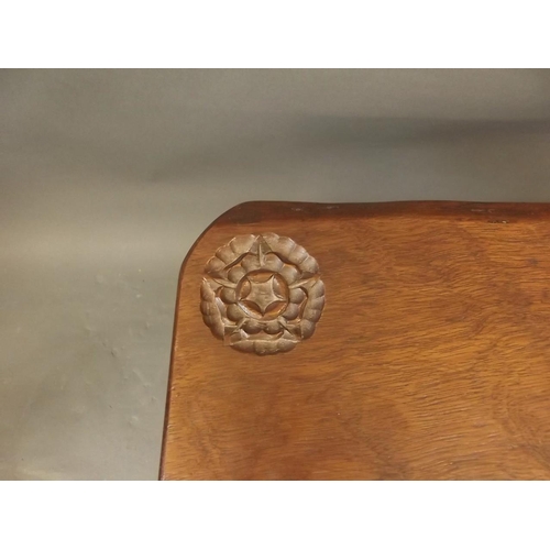 883 - A vintage plank topped occasional table in chestnut with carved Tudor Rose to corner, in the manner ... 