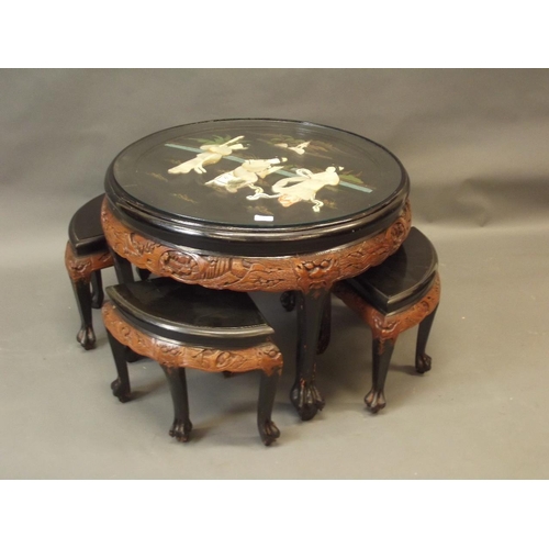 887 - A mid C20th Chinese tea table and matching four stools, with carved decoration, the top with painted... 