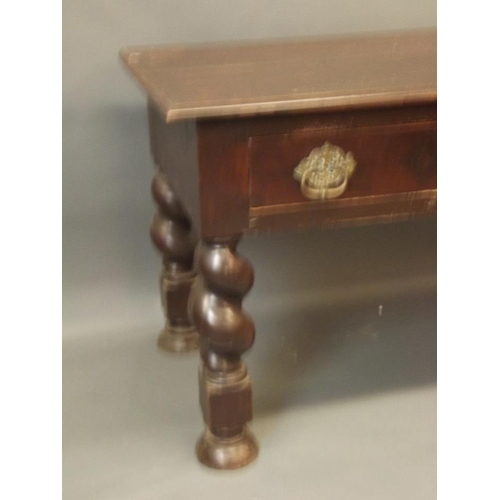 892 - A C19th Anglo-Indian hardwood two drawer side table with brass handles, raised on carved twisted sup... 