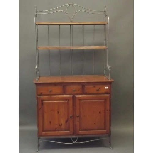 896 - A contemporary Ducal pine dresser with shelved wrought metal upper section over two drawers and cupb... 