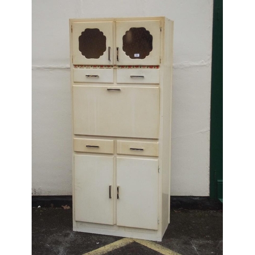 898 - A mid C20th painted kitchen cabinet with two glazed cupboard doors over a fall front, 30