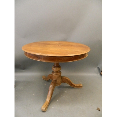 899 - A Continental fruitwood circular top table on a tripod pedestal base, 30