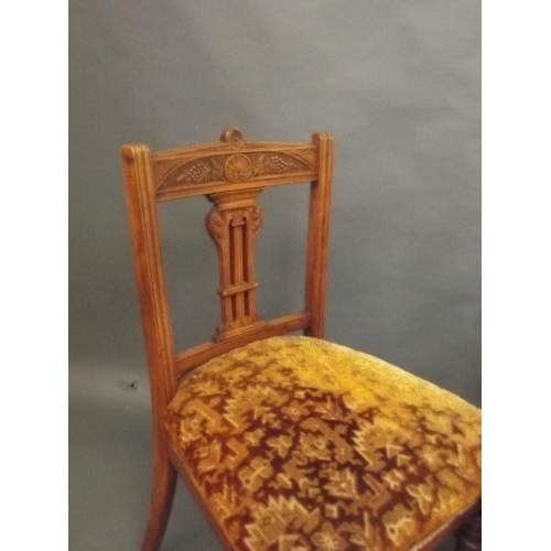 902 - An Edwardian satin walnut side chair with carved decoration and pierced back splat, an elm side chai... 