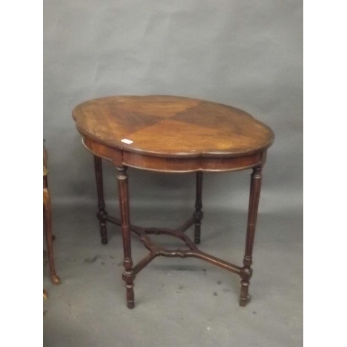 904 - A Victorian shaped top occasional table, raised on fluted supports united by a pierced stretcher, to... 