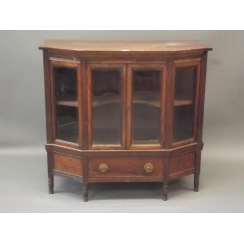 906 - A Victorian rosewood shaped front cabinet with two glazed doors over a single drawer, raised on turn... 