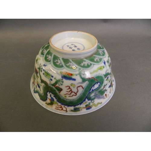 92 - A Chinese Doucai enamel porcelain bowl with twin dragon and flaming pearl decoration, 6 character ma... 