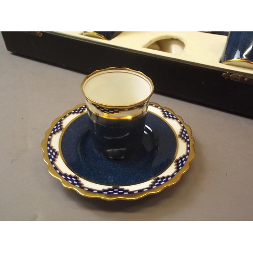 150H - An Aynsley porcelain cabaret set with blue glaze decoration and gilt highlights