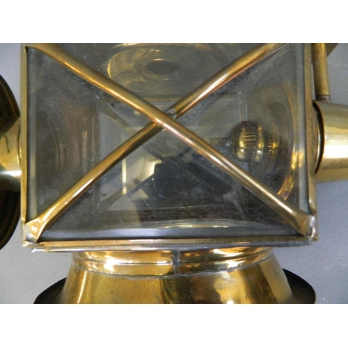 1 - A brass and glass coaching lamp with spirit burner, 17½