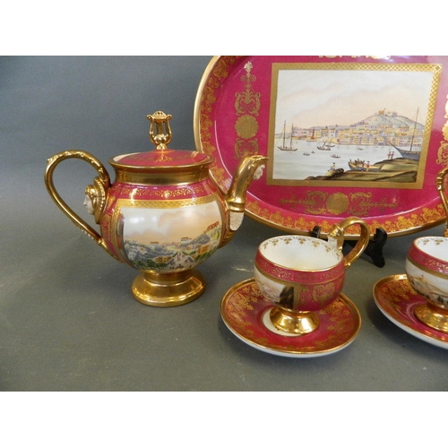 104 - A Berlin style pink ground porcelain tea set for two with gilt highlights, decorated with masks and ... 