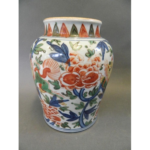 107 - A Chinese Wucai porcelain jar decorated with kylin amongst flowering lotus in bright enamels, 7