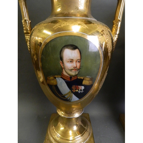 112 - A pair of large porcelain urns with gilt glaze decorated with portraits of Russian Romanov emperors,... 