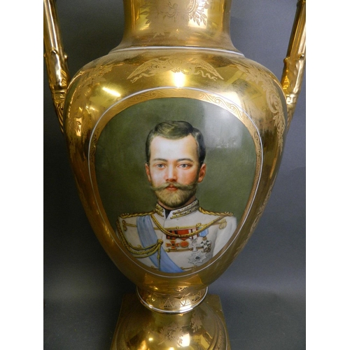 112 - A pair of large porcelain urns with gilt glaze decorated with portraits of Russian Romanov emperors,... 