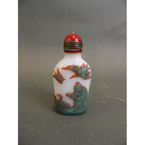 115 - A Chinese moulded resin snuff bottle decorated with boys playing, 3