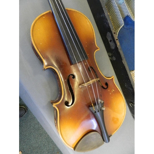 122 - An Italian violin with two piece back, bears label inside, together with a bow and wooden case, 23