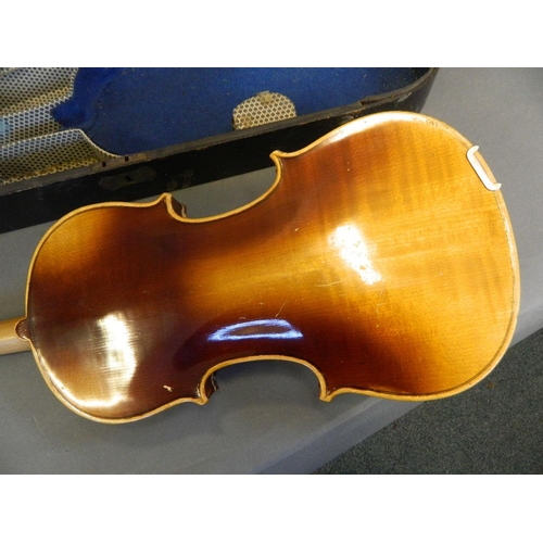 122 - An Italian violin with two piece back, bears label inside, together with a bow and wooden case, 23