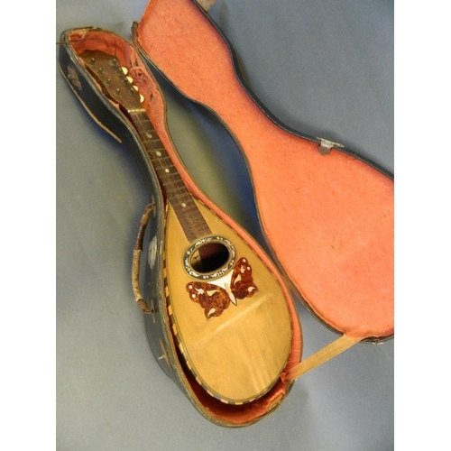 130 - An eight string rosewood mandolin with inlaid decoration by 'Luigi Vicentini, Naples', in a fitted c... 