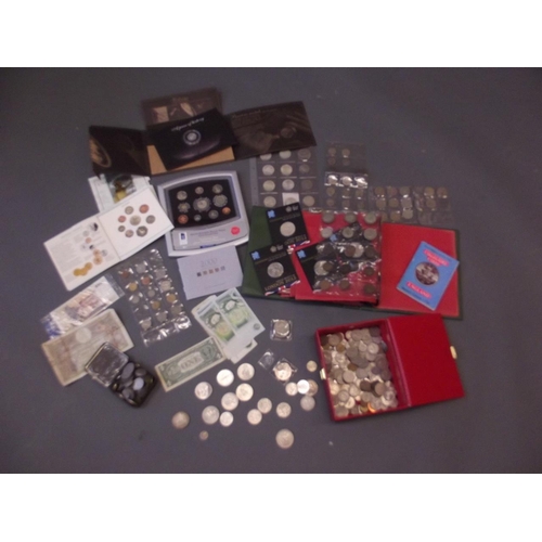 134 - A large collection of coins, British and World, to include crowns, half crowns, 5 pound coins, Royal... 