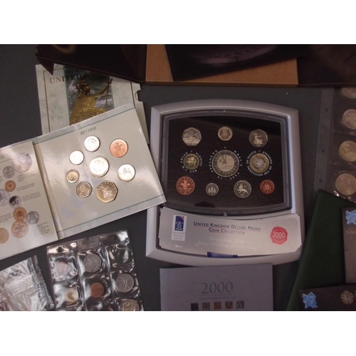 134 - A large collection of coins, British and World, to include crowns, half crowns, 5 pound coins, Royal... 