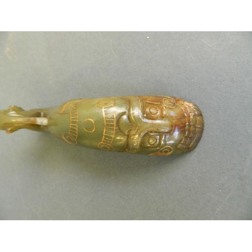 138 - A Chinese green jade pen rest carved in the form of a phoenix with gilt inlaid decoration, 4½