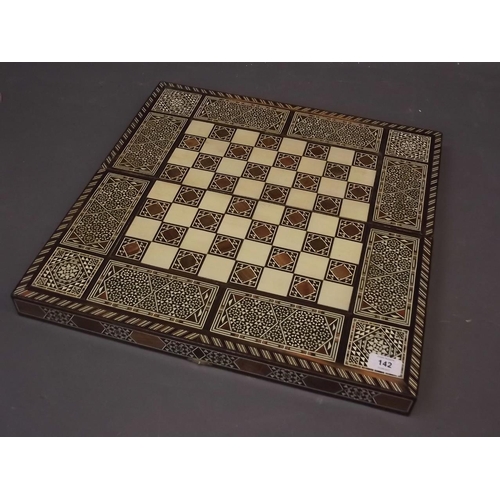 142 - A Damascan inlaid chessboard topped box, opening to reveal a backgammon board, 10