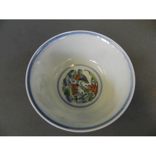 149 - A Chinese Doucai porcelain rice bowl decorated with waterfowl by a pond in bright enamels, 6 charact... 