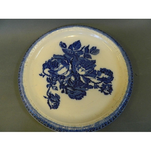 15 - A Staffordshire pottery blue and white cheese dish decorated with roses, 11½