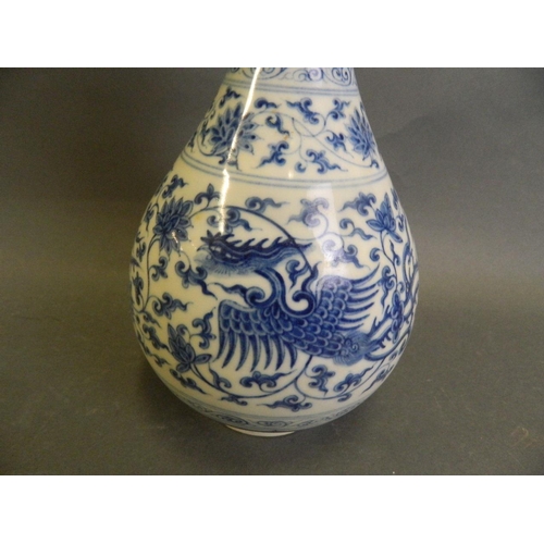 150K - A Chinese blue and white porcelain pear shaped vase with phoenix and scrolling lotus flower decorati... 