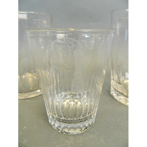 150U - A C19th engraved and cut glass tumbler with masonic decoration, together with two larger C19th glass... 