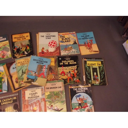 154 - A collection of Hergé 'Adventures of Tintin' soft back books, published by Methuen, and four volumes... 