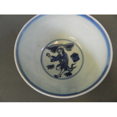 155 - A Chinese blue and white porcelain rice bowl decorated with figures relaxing in a garden, 6 characte... 