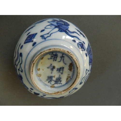 155 - A Chinese blue and white porcelain rice bowl decorated with figures relaxing in a garden, 6 characte... 