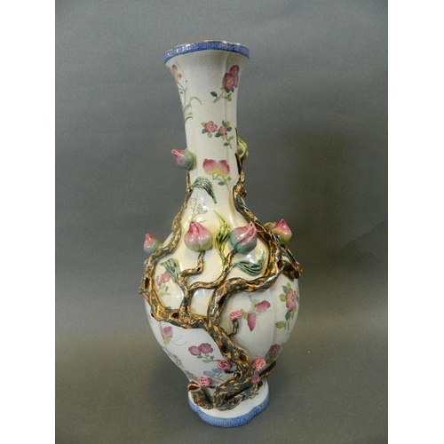 162 - A Chinese polychrome enamel porcelain vase with bulbous body and slender neck, decorated with a frui... 