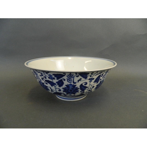 165 - A Chinese blue and white porcelain bowl with scrolling lotus flower and character decoration, 6 char... 