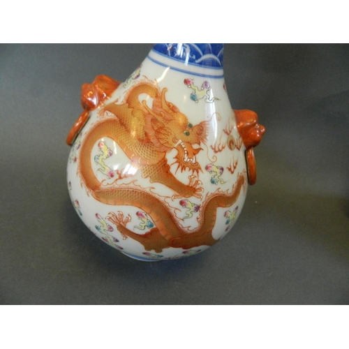 174 - A Chinese porcelain bottle vase with blue and white flower shaped neck, the bulbous body decorated w... 