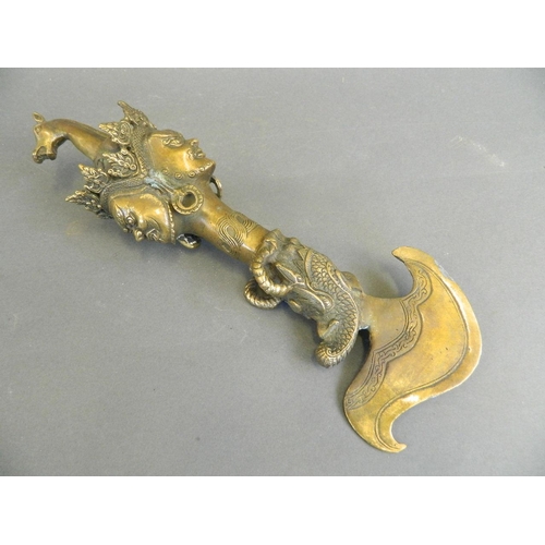 175 - A Sino-Tibetan bronze Kartika knife with deity mask decoration, 11½