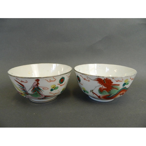 186 - A pair of Chinese Republic polychrome enamel porcelain rice bowls with stylised dragon and phoenix d... 