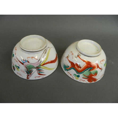 186 - A pair of Chinese Republic polychrome enamel porcelain rice bowls with stylised dragon and phoenix d... 