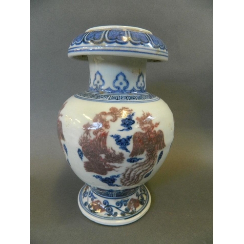 189 - A Chinese porcelain vase of unusual form with bulbous body and flared foot, decorated with a blue an... 