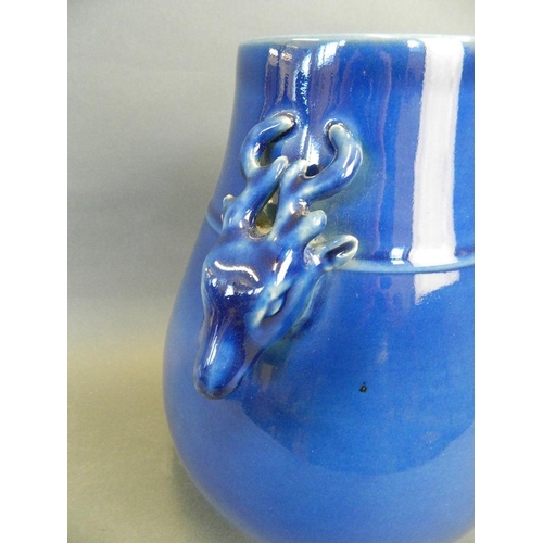 205 - A Chinese blue ground porcelain vase with twin stag head handles, 10½