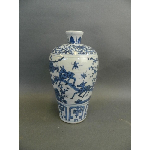 216 - A Chinese blue and white meiping vase decorated with storks and deer, 10½