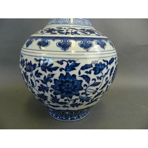 33 - A large Chinese blue and white vase with scrolling lotus flower decoration, seal mark to base, 15